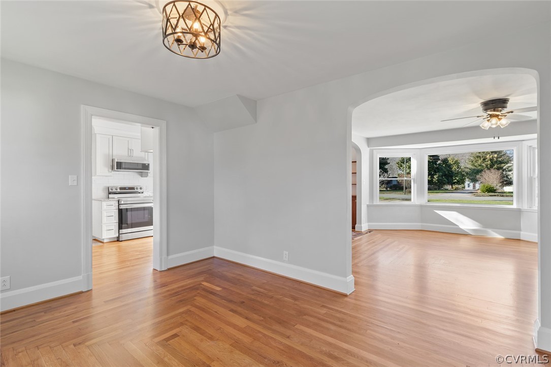 369 Main Street Reedville, VA 22539 - Photo 13 of 44 wooden floor in an empty room with a window