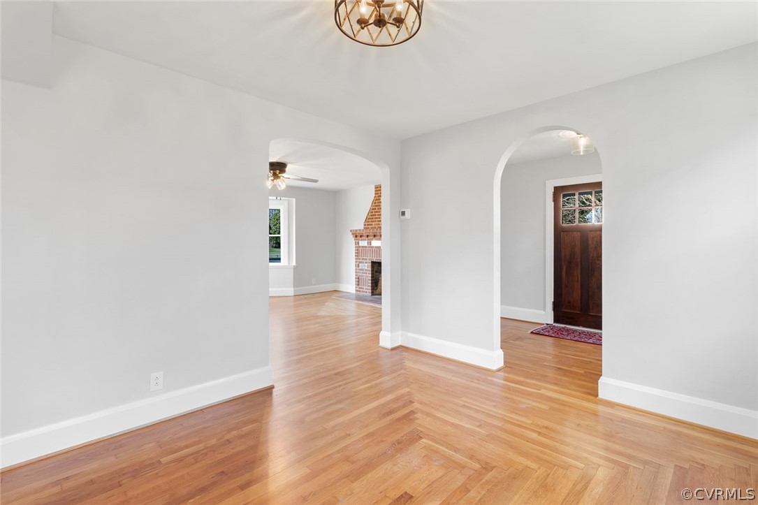 369 Main Street Reedville, VA 22539 - Photo 15 of 44 a view of an empty room with wooden floor and a mirror