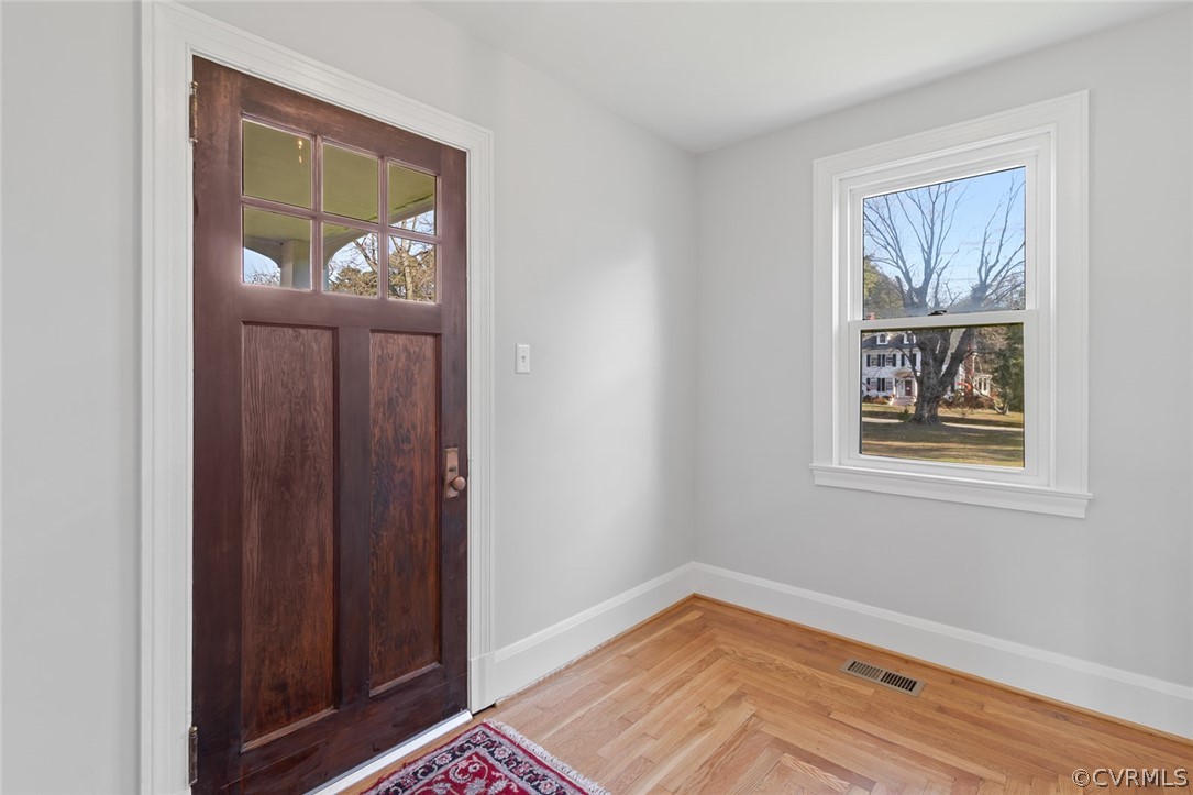 369 Main Street Reedville, VA 22539 - Photo 17 of 44 a view of empty room with window and wooden floor
