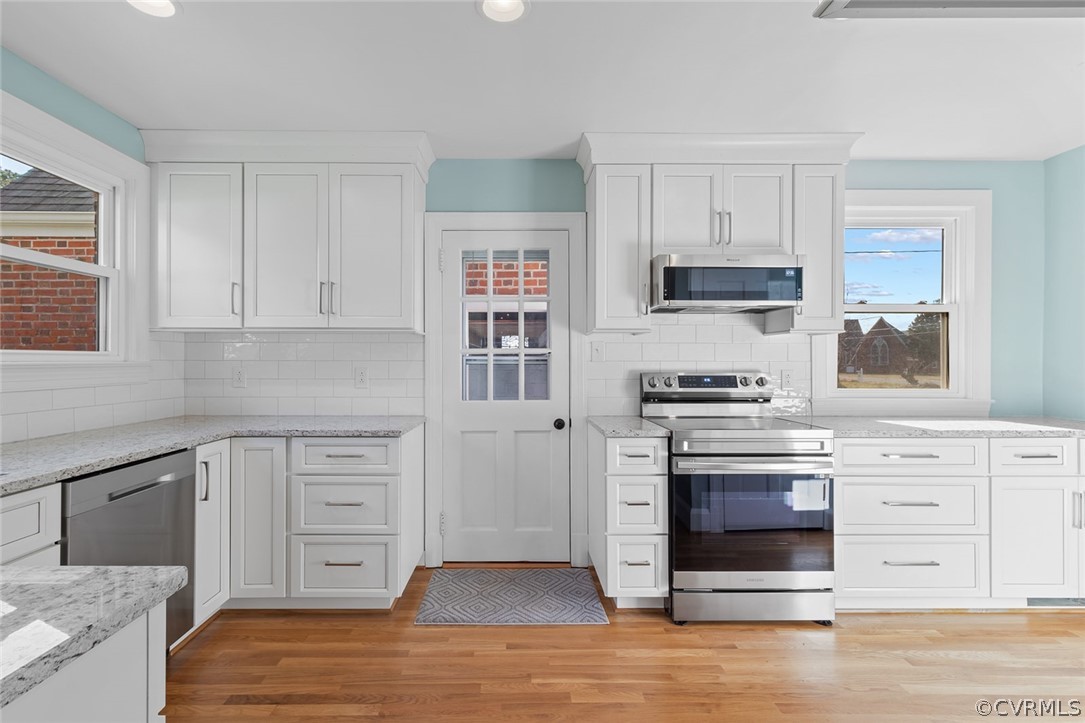 369 Main Street Reedville, VA 22539 - Photo 2 of 44 a kitchen with stainless steel appliances granite countertop a stove and a sink