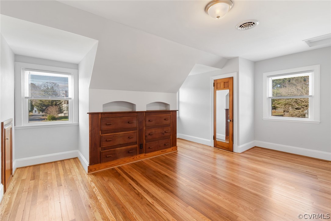 369 Main Street Reedville, VA 22539 - Photo 22 of 44 a room with hard wood floors and a window