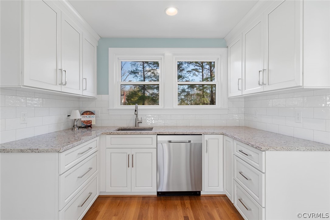 369 Main Street Reedville, VA 22539 - Photo 4 of 44 a kitchen with white cabinets and sink