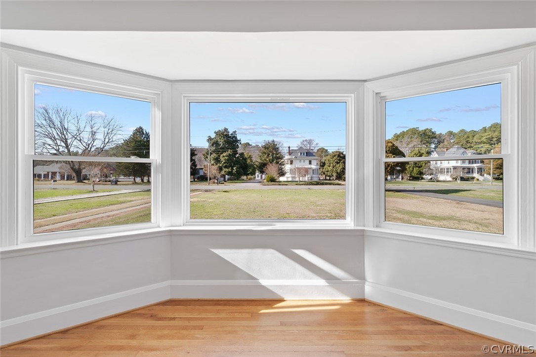 369 Main Street Reedville, VA 22539 - Photo 9 of 44 a view of a room with wooden floor and a floor to ceiling window