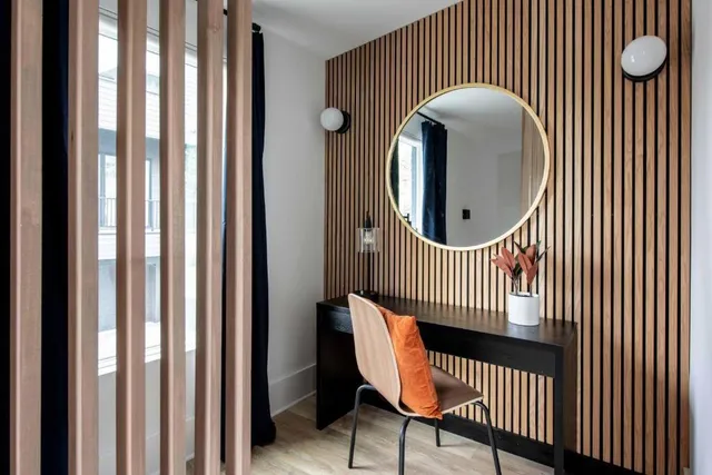 a view of a livingroom with furniture and a window
