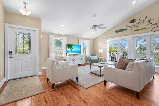 a view of a dining room with furniture and a chandelier