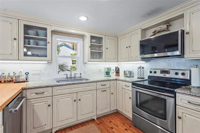 a bathroom with a shower sink and mirror