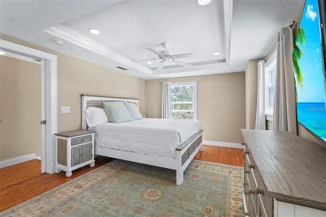 a bed room with a bed and a chair