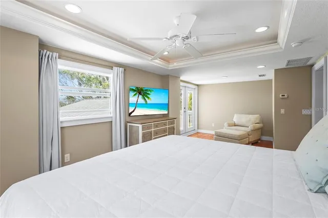 a spacious bedroom with a bed and a shower