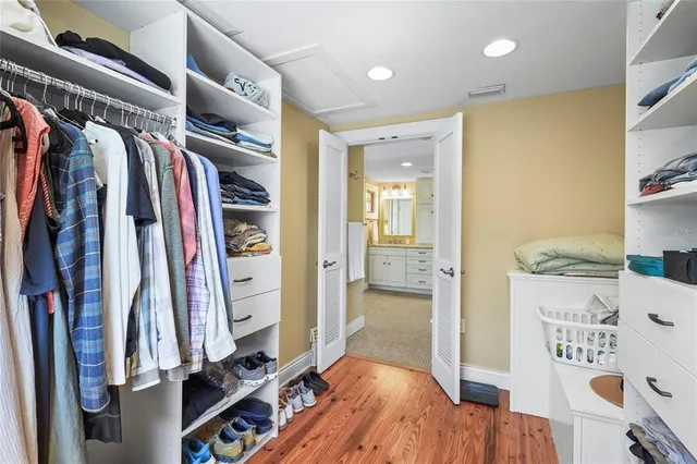 a balcony with chairs and wooden floor