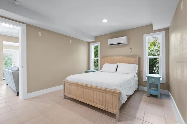 a view of a house with a tree next to a yard