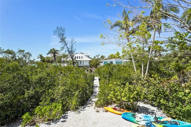 a balcony with wooden floor and fence
