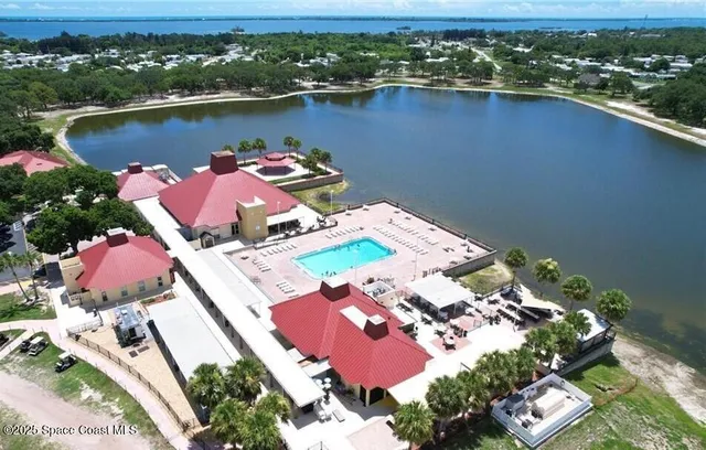 an aerial view of a house with a lake view