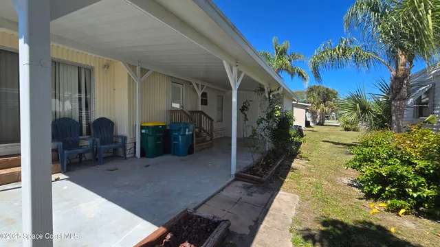 a lobby with furniture and a potted plant