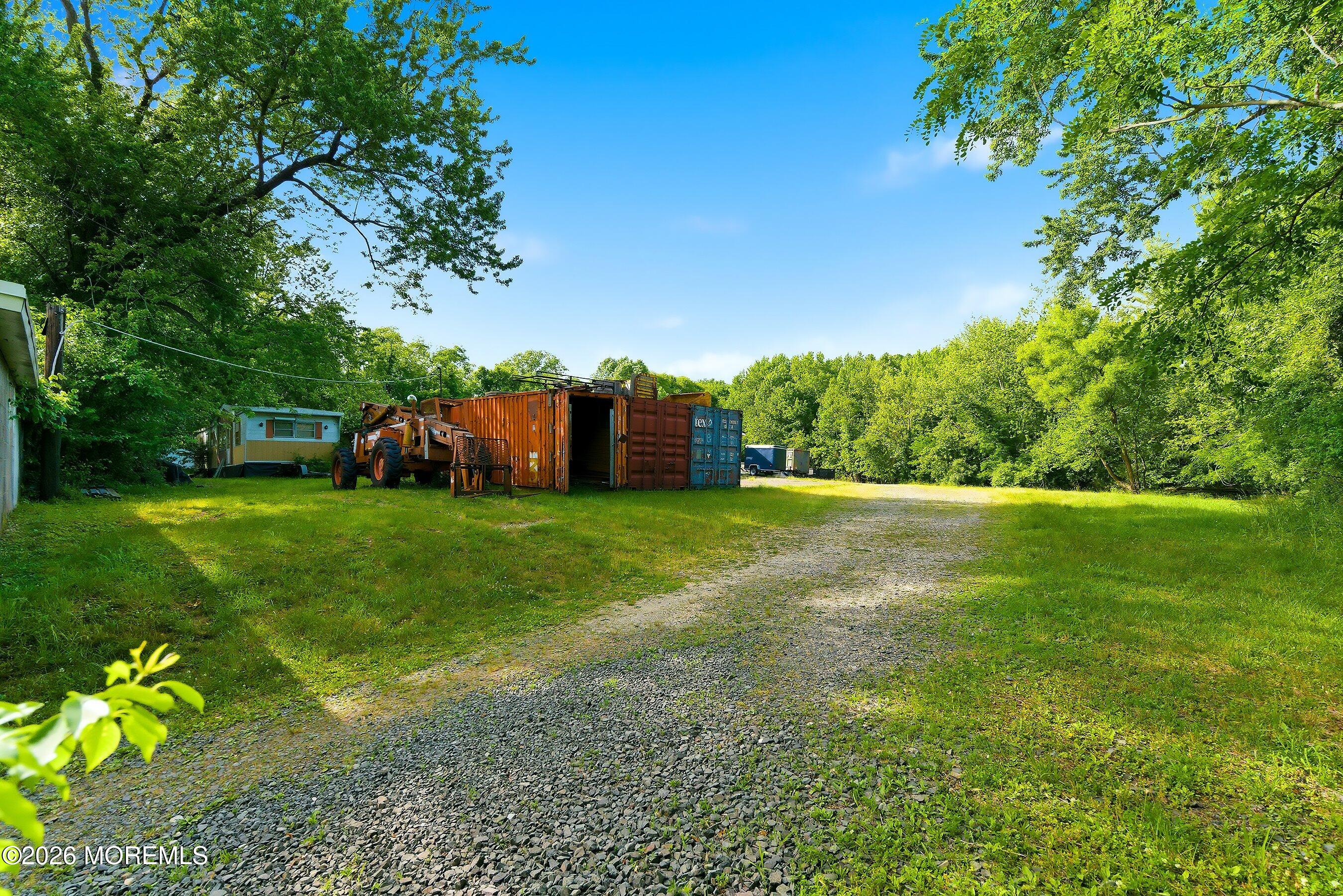 26 Megill Road Farmingdale, NJ 07727 - Photo 12 of 16 a view of a garden with large trees
