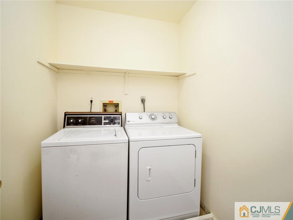 1402 Timber Oaks Road, Unit 1402 Edison, NJ 08820 - Photo 16 of 19 a utility room with dryer and washer