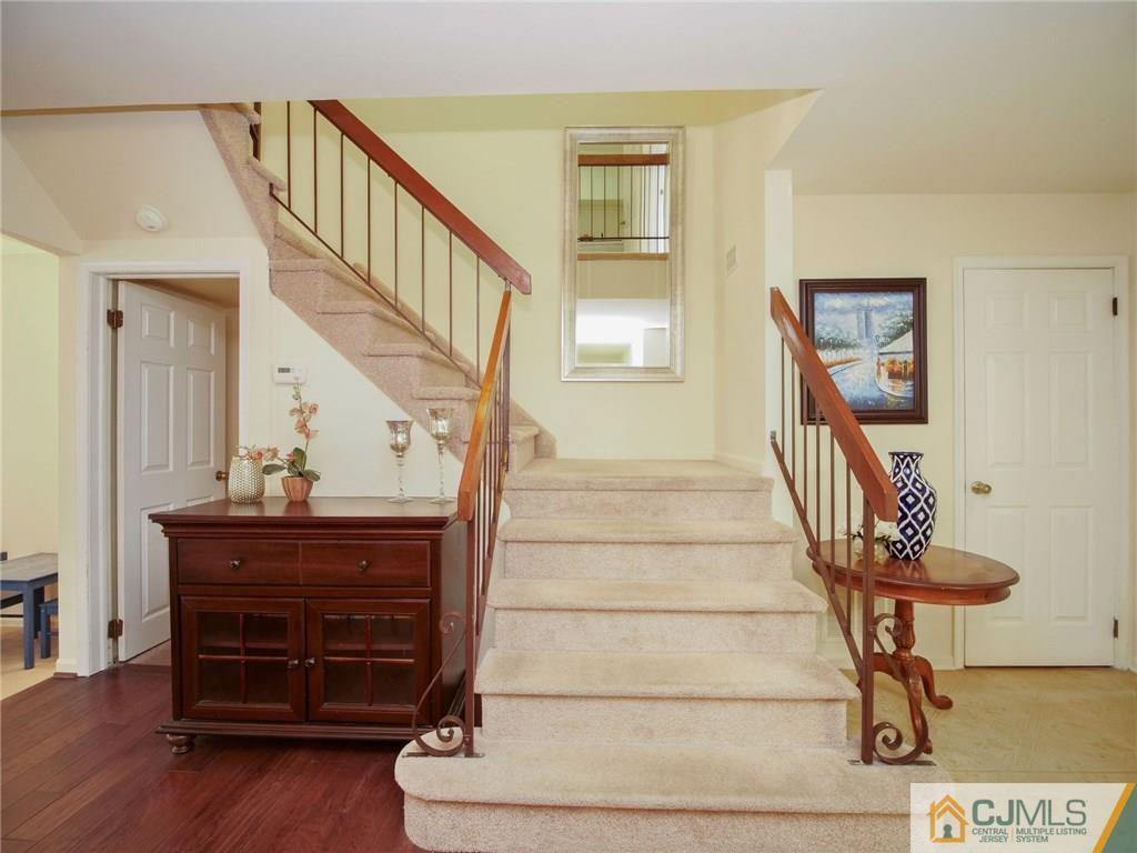 1402 Timber Oaks Road, Unit 1402 Edison, NJ 08820 - Photo 8 of 19 a view of entryway with wooden floor and stairs
