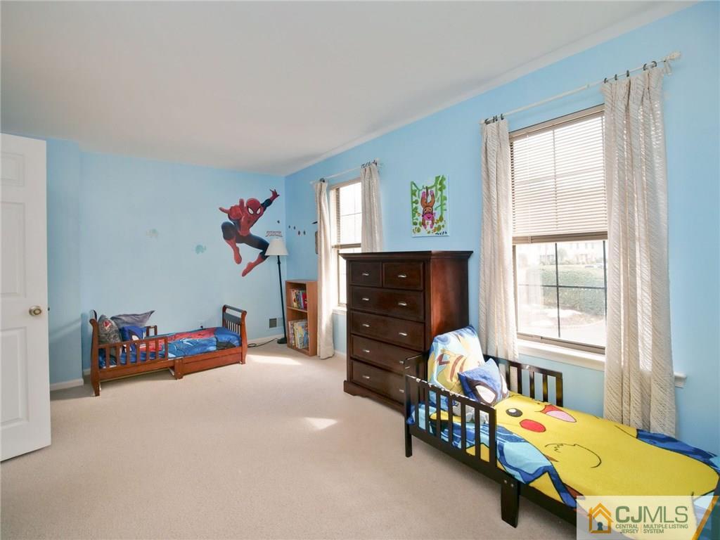 1402 Timber Oaks Road, Unit 1402 Edison, NJ 08820 - Photo 10 of 19 a living room with furniture toys and a window