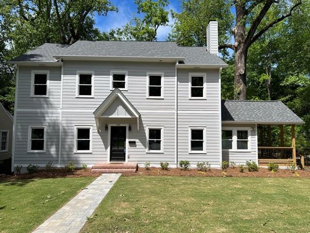 a front view of a house with a yard