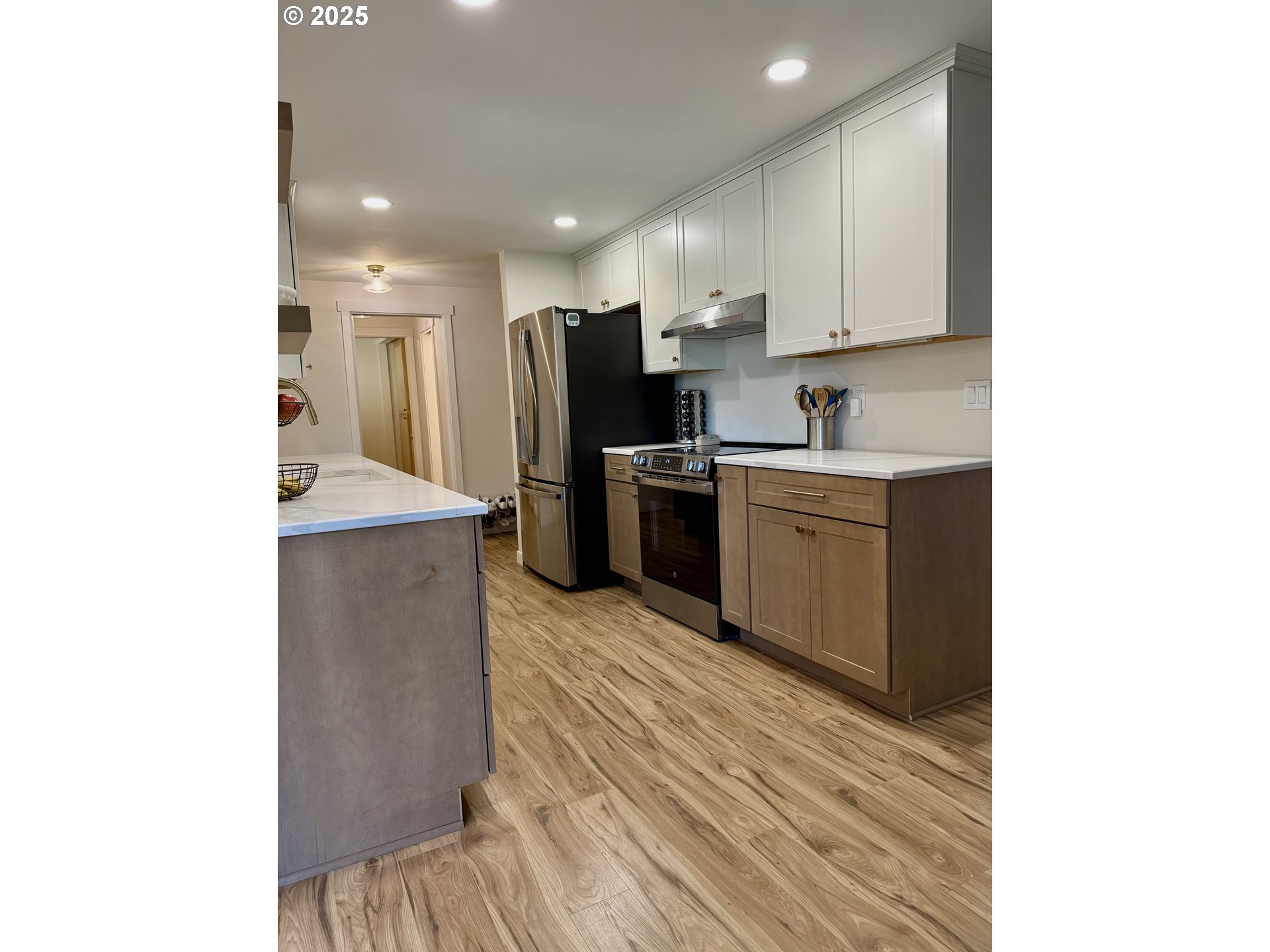 1275 Island Street Springfield, OR 97477 - Photo 11 of 36 a kitchen with stainless steel appliances granite countertop a sink and a refrigerator