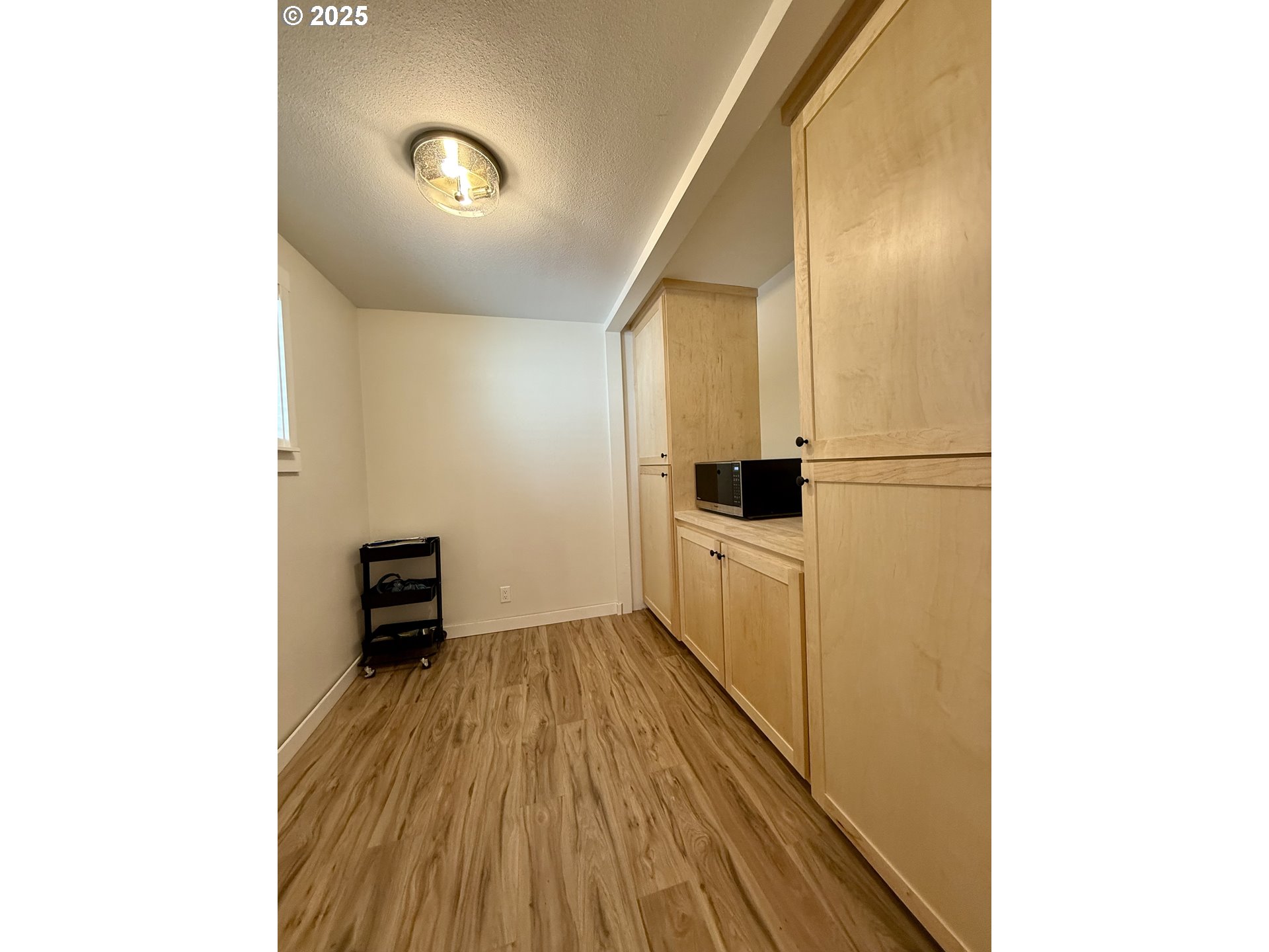 1275 Island Street Springfield, OR 97477 - Photo 12 of 36 a view of a hallway with wooden floor