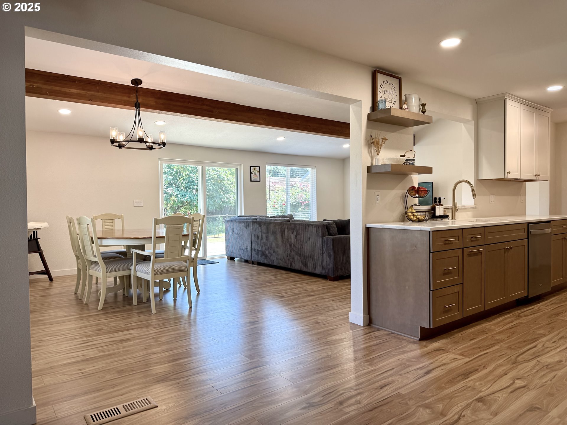 1275 Island Street Springfield, OR 97477 - Photo 13 of 36 a kitchen with stainless steel appliances a dining table chairs and wooden floor