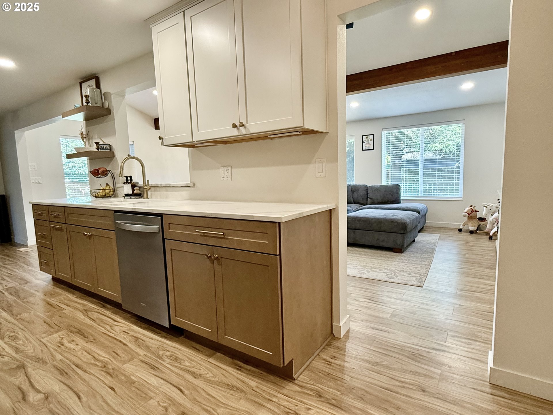 1275 Island Street Springfield, OR 97477 - Photo 14 of 36 a kitchen with stainless steel appliances granite countertop a sink and cabinets with wooden floor