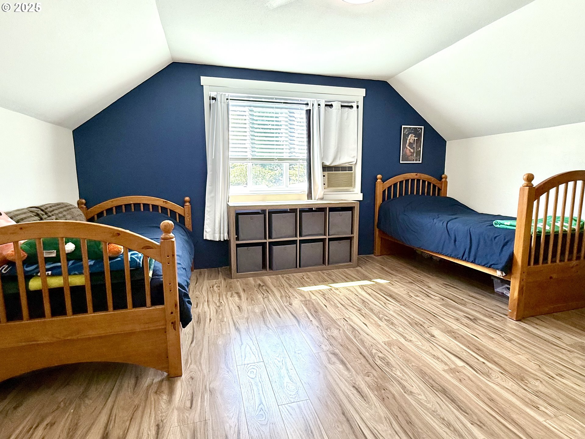 1275 Island Street Springfield, OR 97477 - Photo 27 of 36 a bedroom with a bed and wooden floor