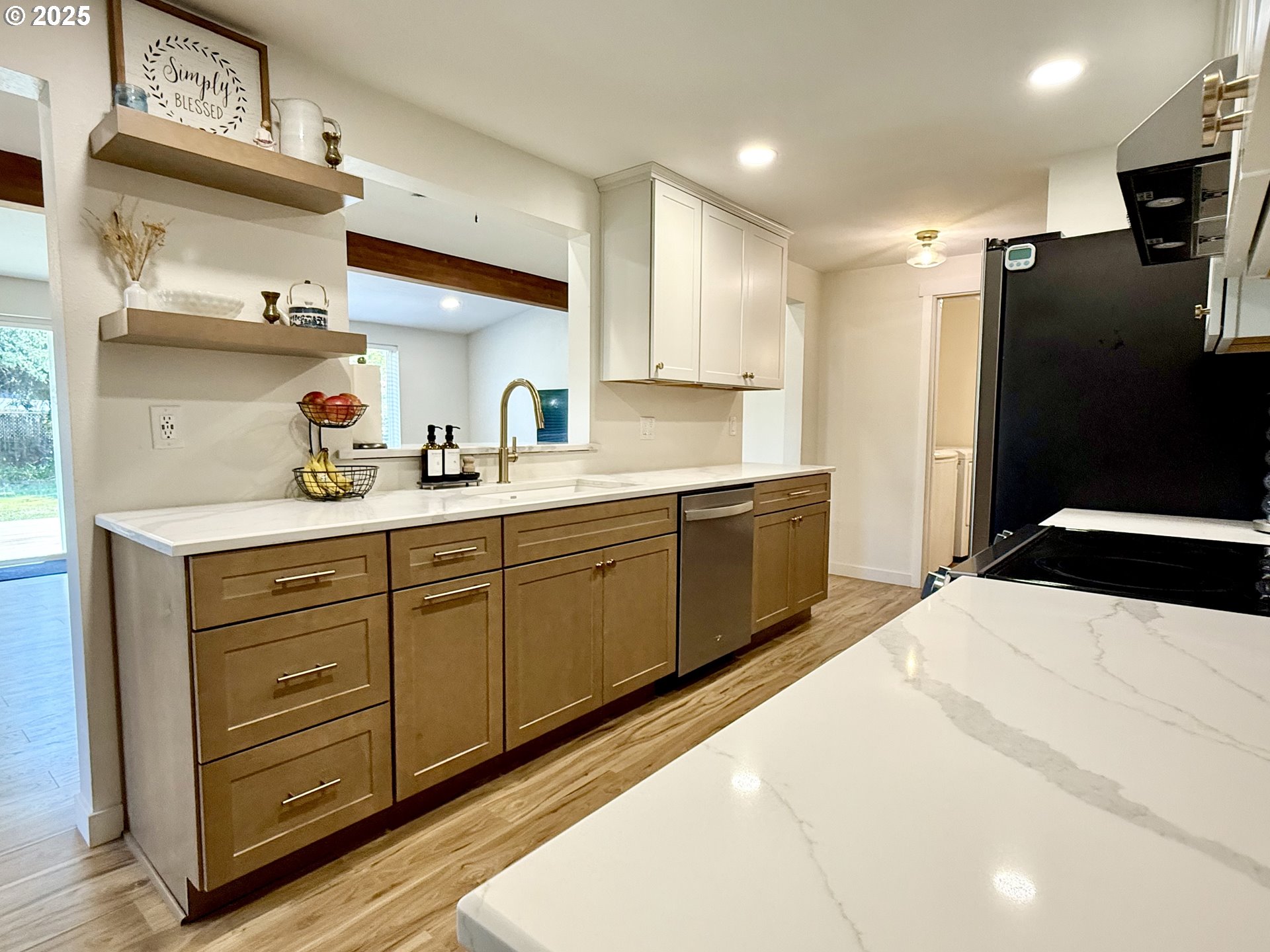 1275 Island Street Springfield, OR 97477 - Photo 10 of 36 a kitchen with a sink a refrigerator and cabinets