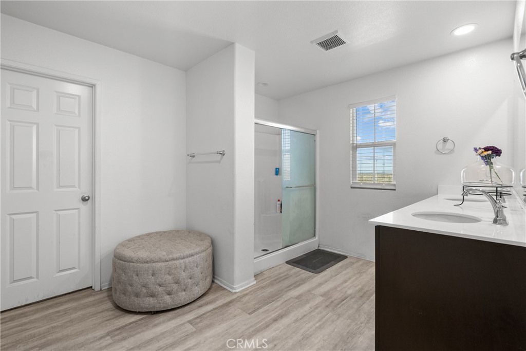 6949 Beale Road Palmdale, CA 93552 - Photo 23 of 32 a bathroom with a sink and a mirror
