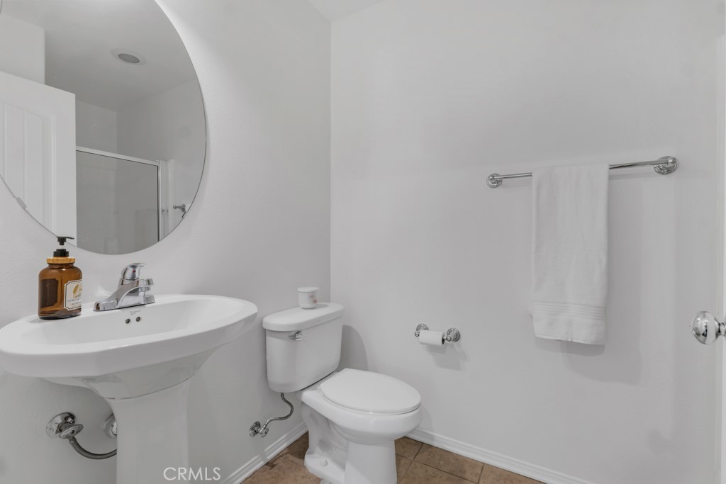 20317 Livorno Porter Ranch Porter Ranch, CA 91326 - Photo 14 of 33 a bathroom with a sink toilet and a mirror