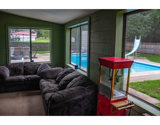 25 Marks Road Weymouth, MA 02189 - Photo 12 of 14 a living room with furniture and a floor to ceiling window