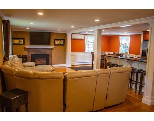 25 Marks Road Weymouth, MA 02189 - Photo 2 of 14 a living room with furniture and a flat screen tv