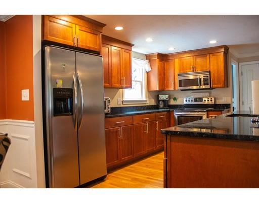 25 Marks Road Weymouth, MA 02189 - Photo 4 of 14 a kitchen with stainless steel appliances granite countertop a refrigerator a sink and a stove