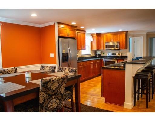 25 Marks Road Weymouth, MA 02189 - Photo 5 of 14 a kitchen with stainless steel appliances kitchen island granite countertop a table and chairs