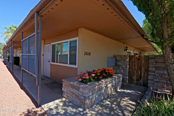 a kitchen with granite countertop a stove a sink and a microwave