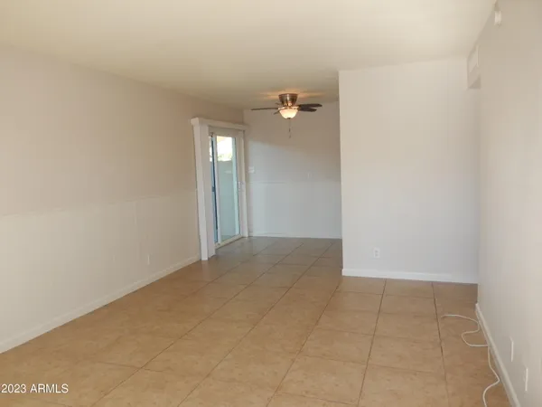 a view of an empty room with a bathroom