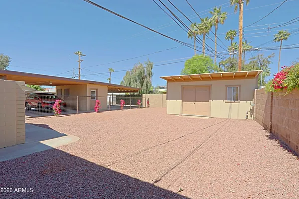 a view of a street with a garage
