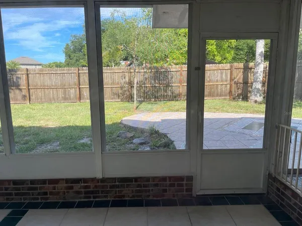 a view of a balcony with wooden floor