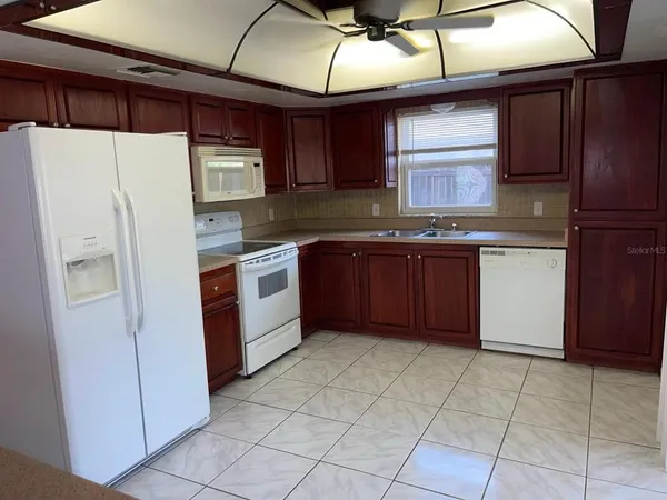 a kitchen with a stove microwave and refrigerator