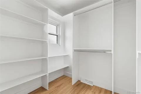 a view of an empty walk in closet