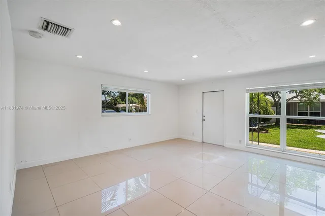 a view of an empty room with a window