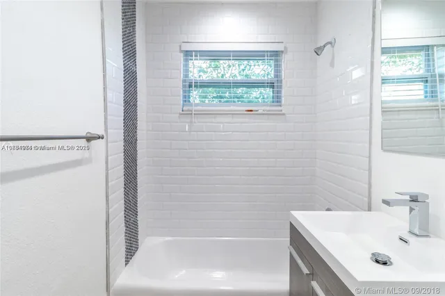 a view of a kitchen with wooden floor and a sink