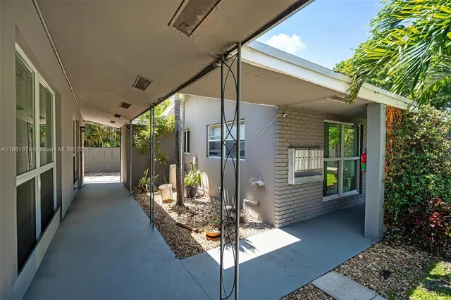 a view of backyard with outdoor seating and green space