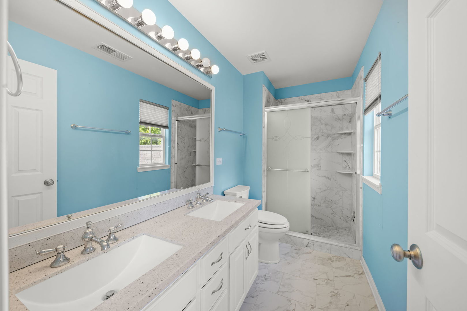 235 Garden Drive Elgin, IL 60124 - Photo 13 of 25 a bathroom with a granite countertop sink a mirror and a bathtub