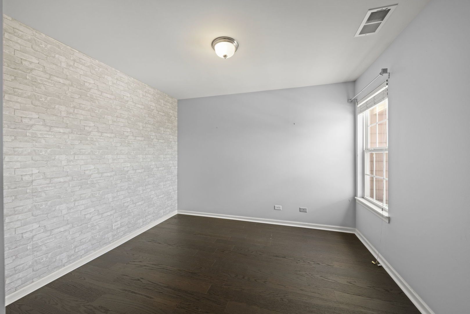 235 Garden Drive Elgin, IL 60124 - Photo 14 of 25 an empty room with wooden floor and windows