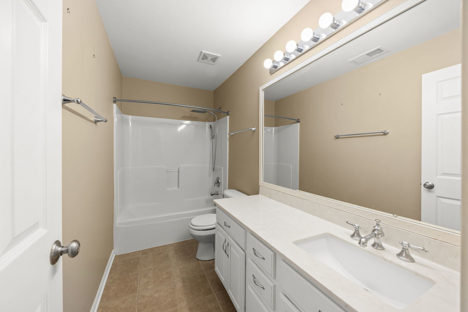 235 Garden Drive Elgin, IL 60124 - Photo 15 of 25 a bathroom with a sink a toilet and shower