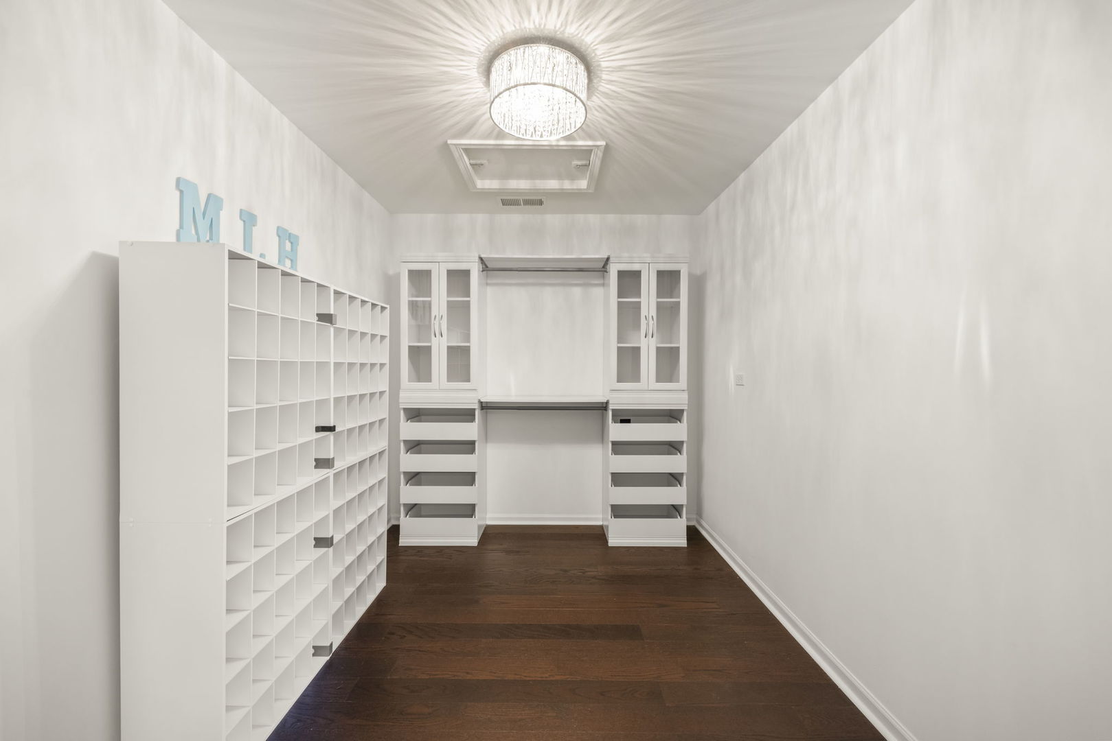 235 Garden Drive Elgin, IL 60124 - Photo 16 of 25 a view of walk in closet with empty racks