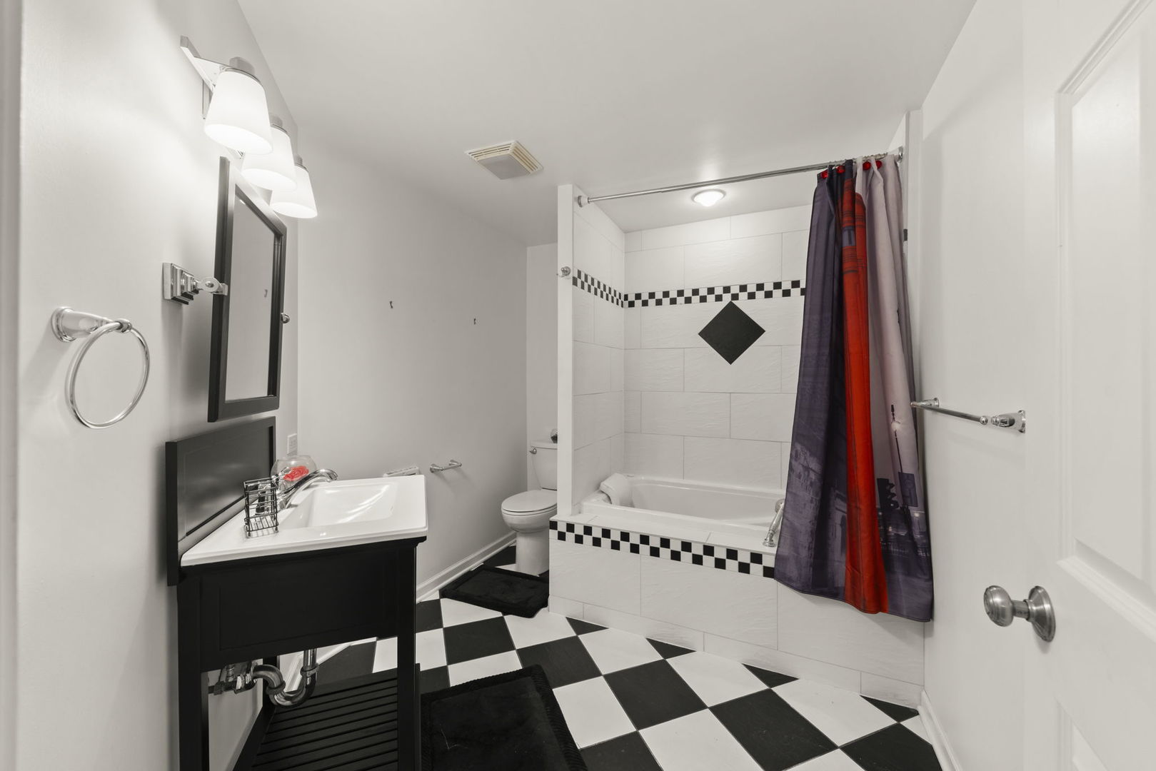 235 Garden Drive Elgin, IL 60124 - Photo 19 of 25 a bathroom with a sink a toilet and shower