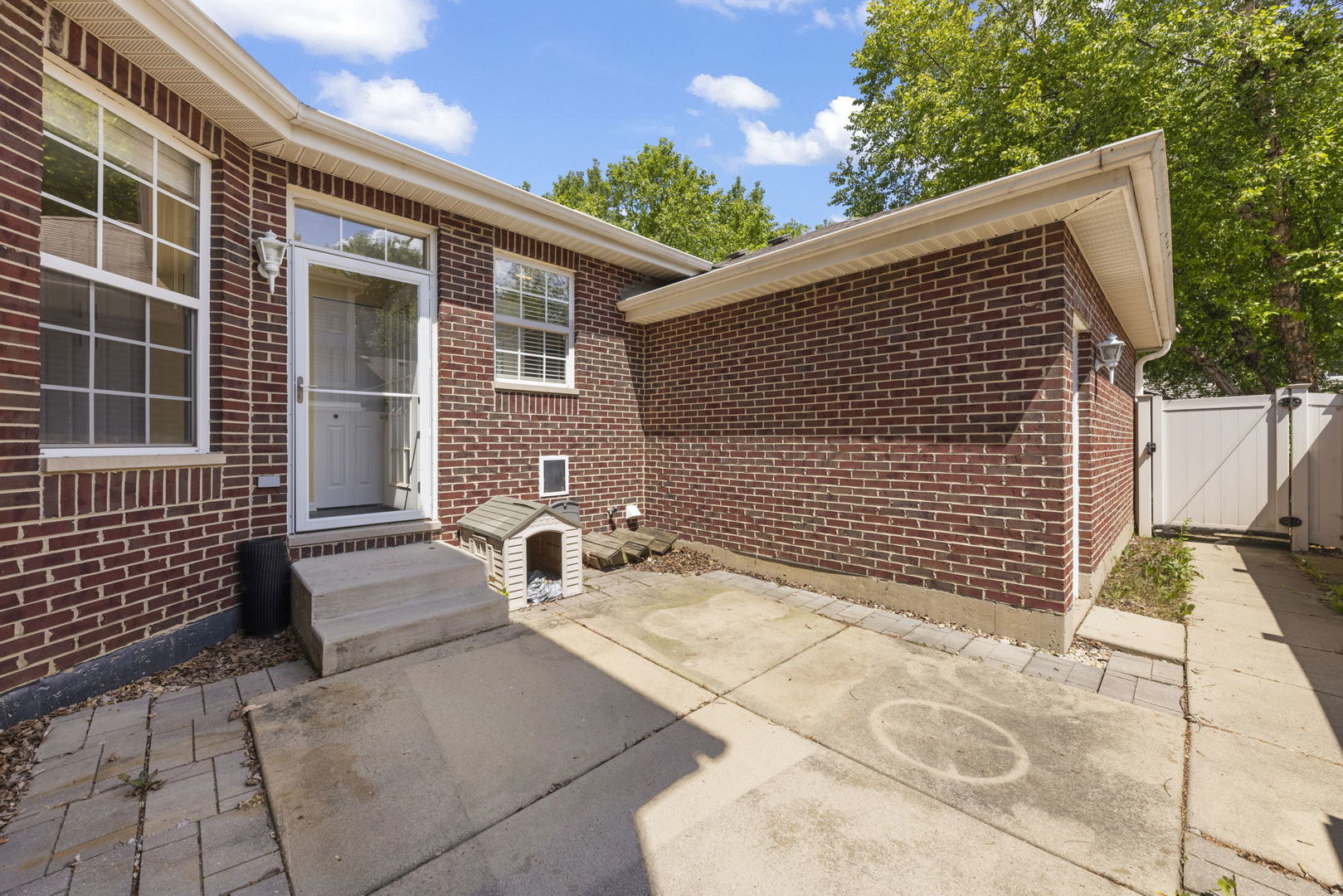 235 Garden Drive Elgin, IL 60124 - Photo 20 of 25 a view of a house with a patio