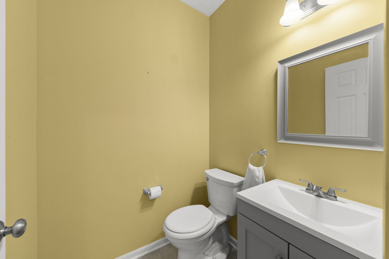 235 Garden Drive Elgin, IL 60124 - Photo 7 of 25 a bathroom with a sink and a toilet